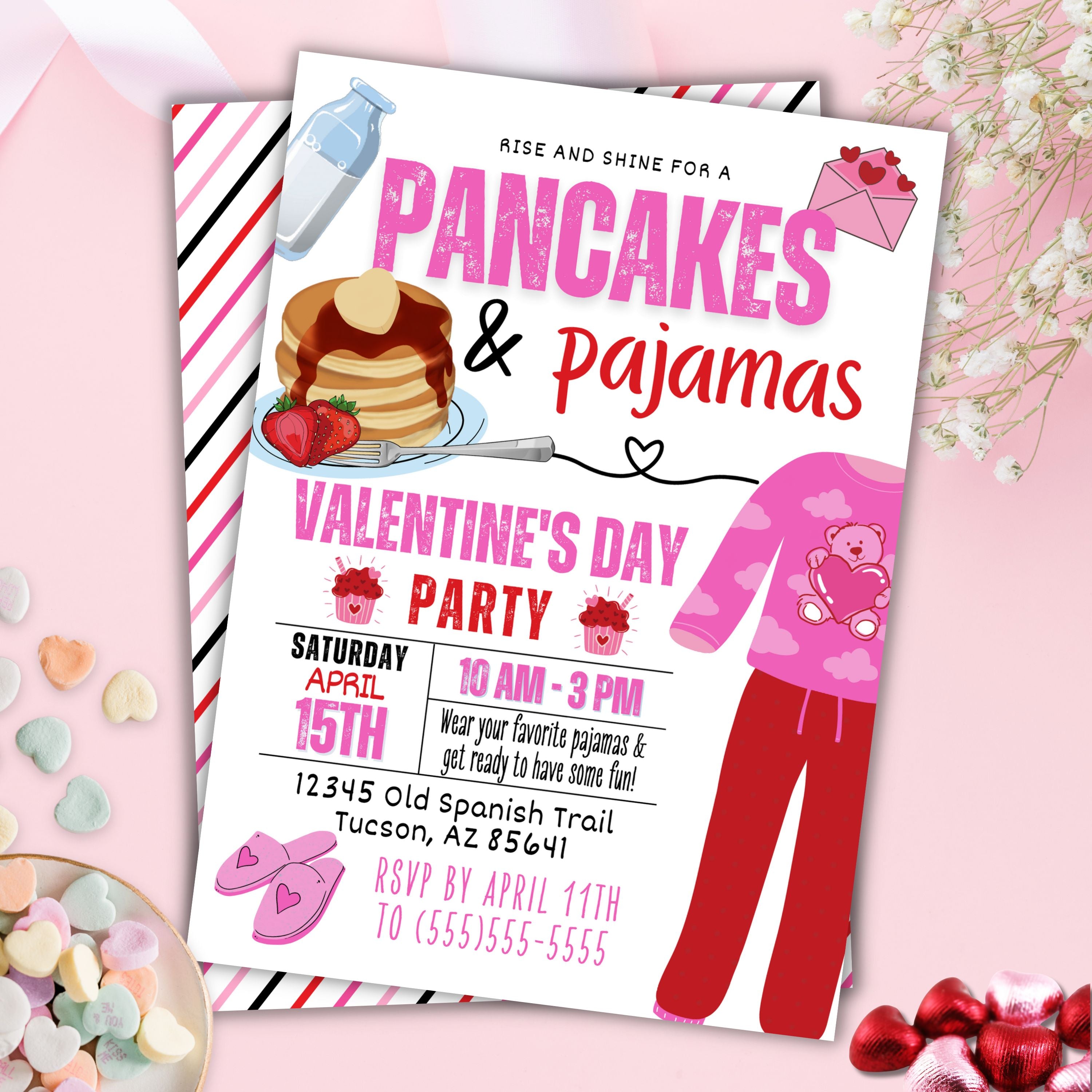 pink and red themed pancakes and pajamas party invitation set on a pink table top with candy and flowers
