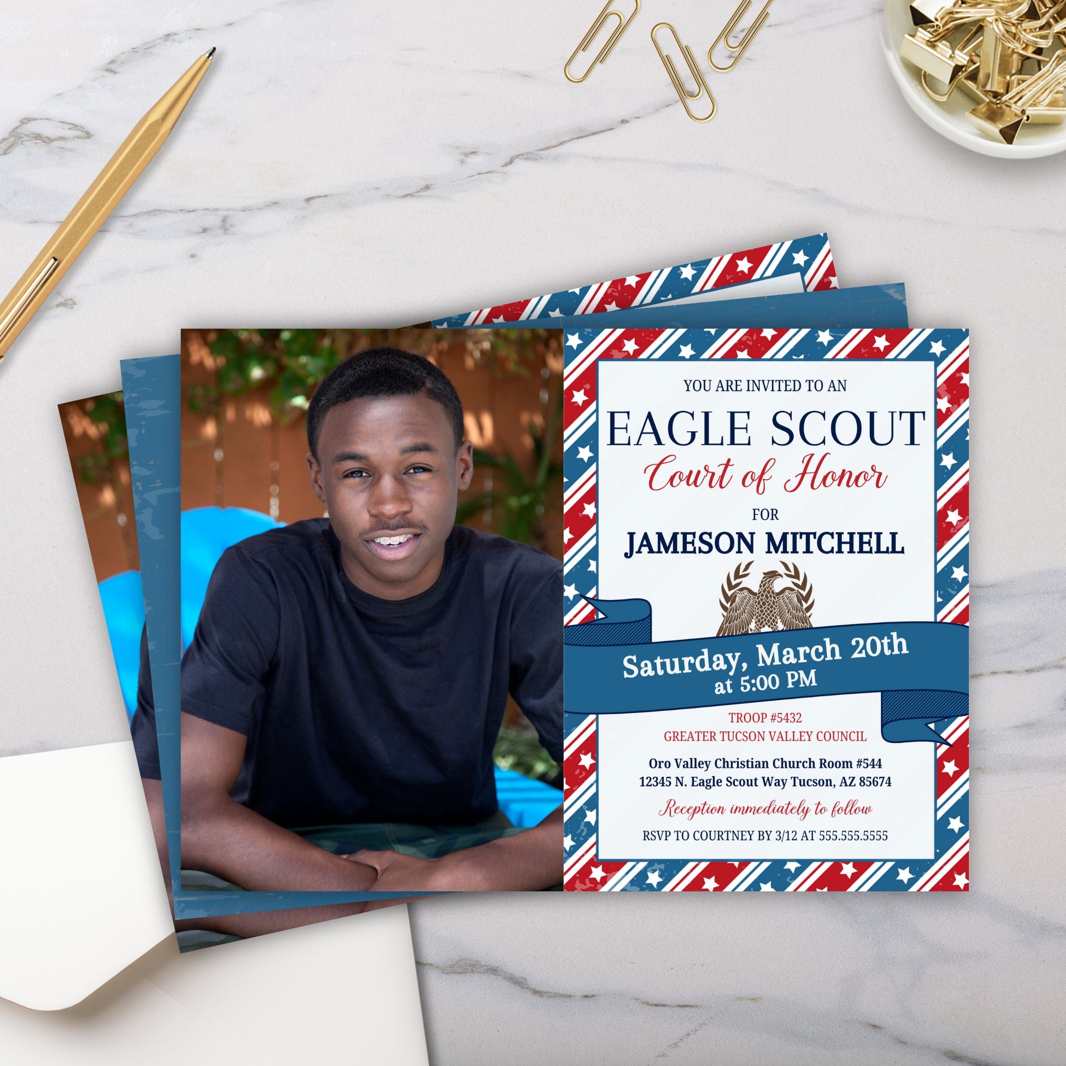 image showing multiple copies of an eagle scout court of honor invitation with photo and patriotic theme on marble surface with gold pen and paper clips