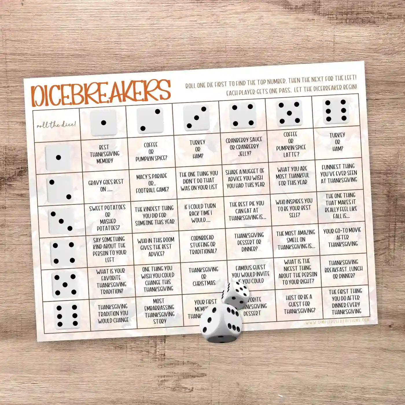 Dicebreakers game sheet with dice on a wooden surface representing a collection of printable games, ice breakers, and conversation starters created by Simple Desert Designs.