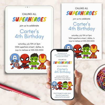 Superhero-themed birthday invitations on a phone and tablet with a pen and decorative plate.