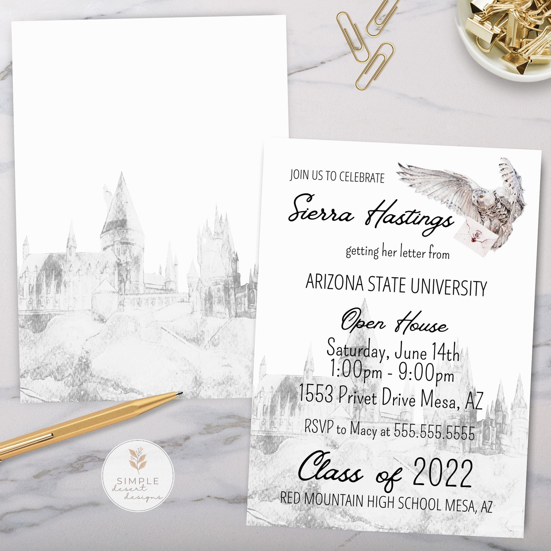 Graduation invitation with owl carrying envelope with maroon wax seal flying over a castle design on a marble surface with stationery items.