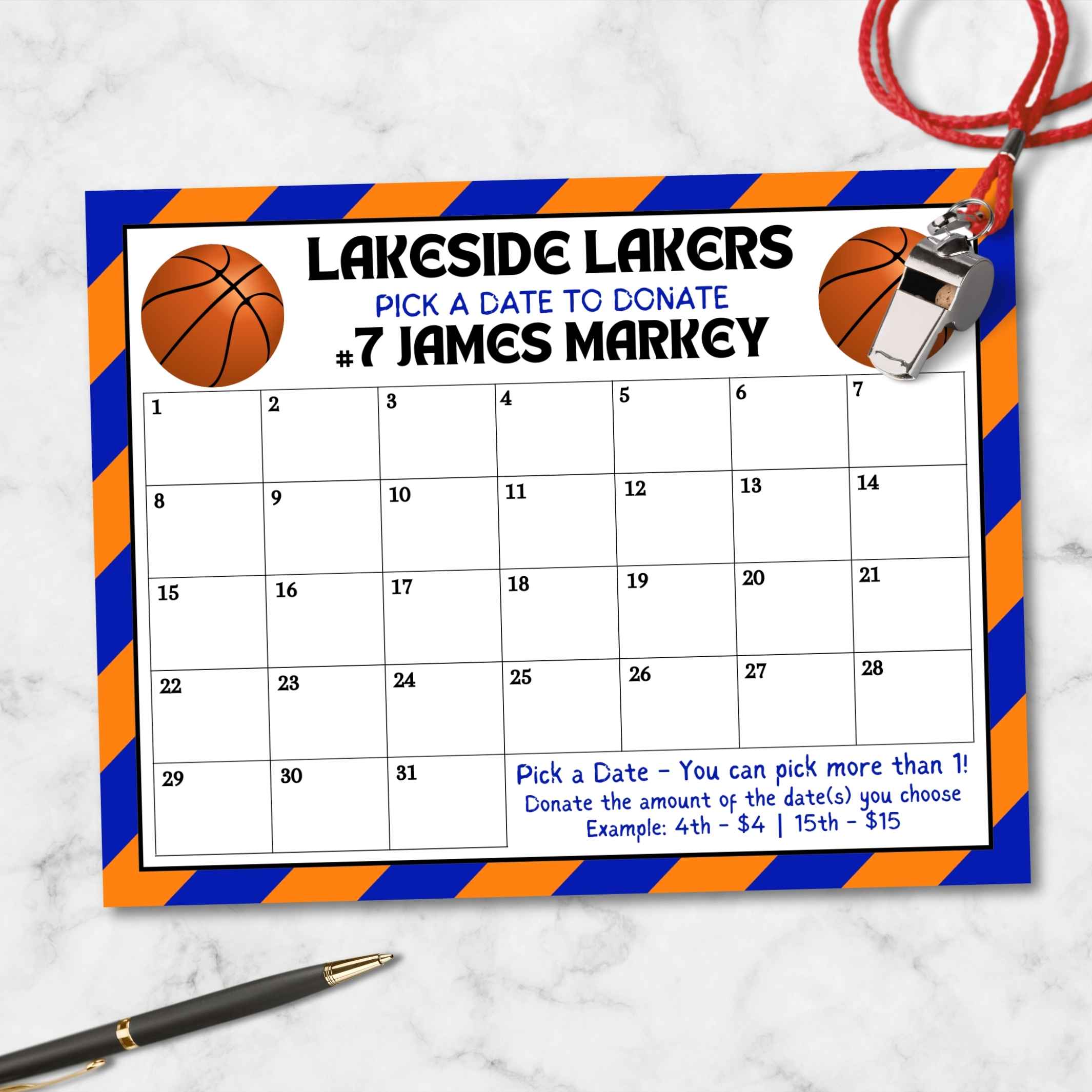 Calendar with 'Lakeside Lakers' and basketball theme on a marble surface with whistle and pen for team fundraising event