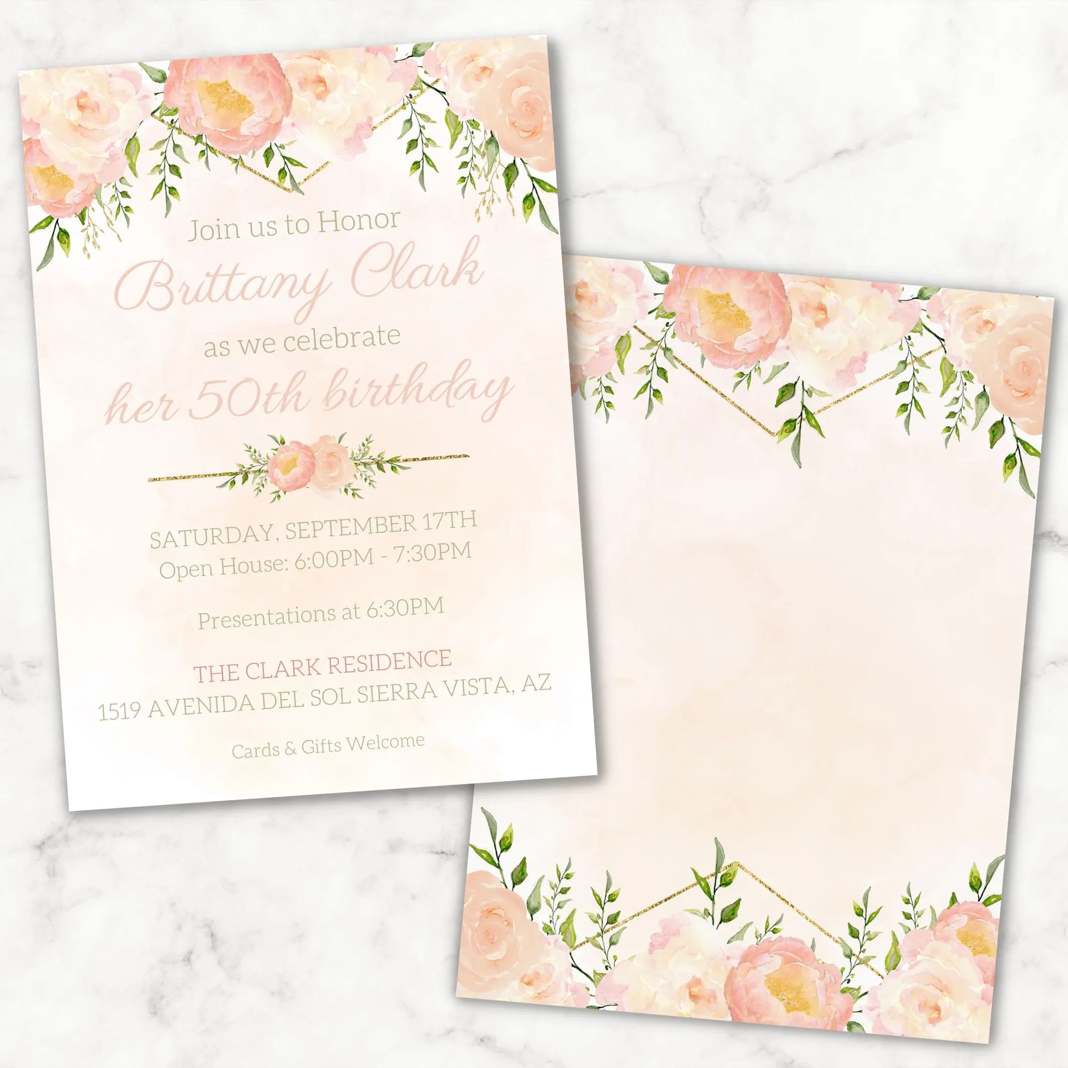 Customized peach and gold floral birthday invitation card for any milestone celebration on a marble surface
