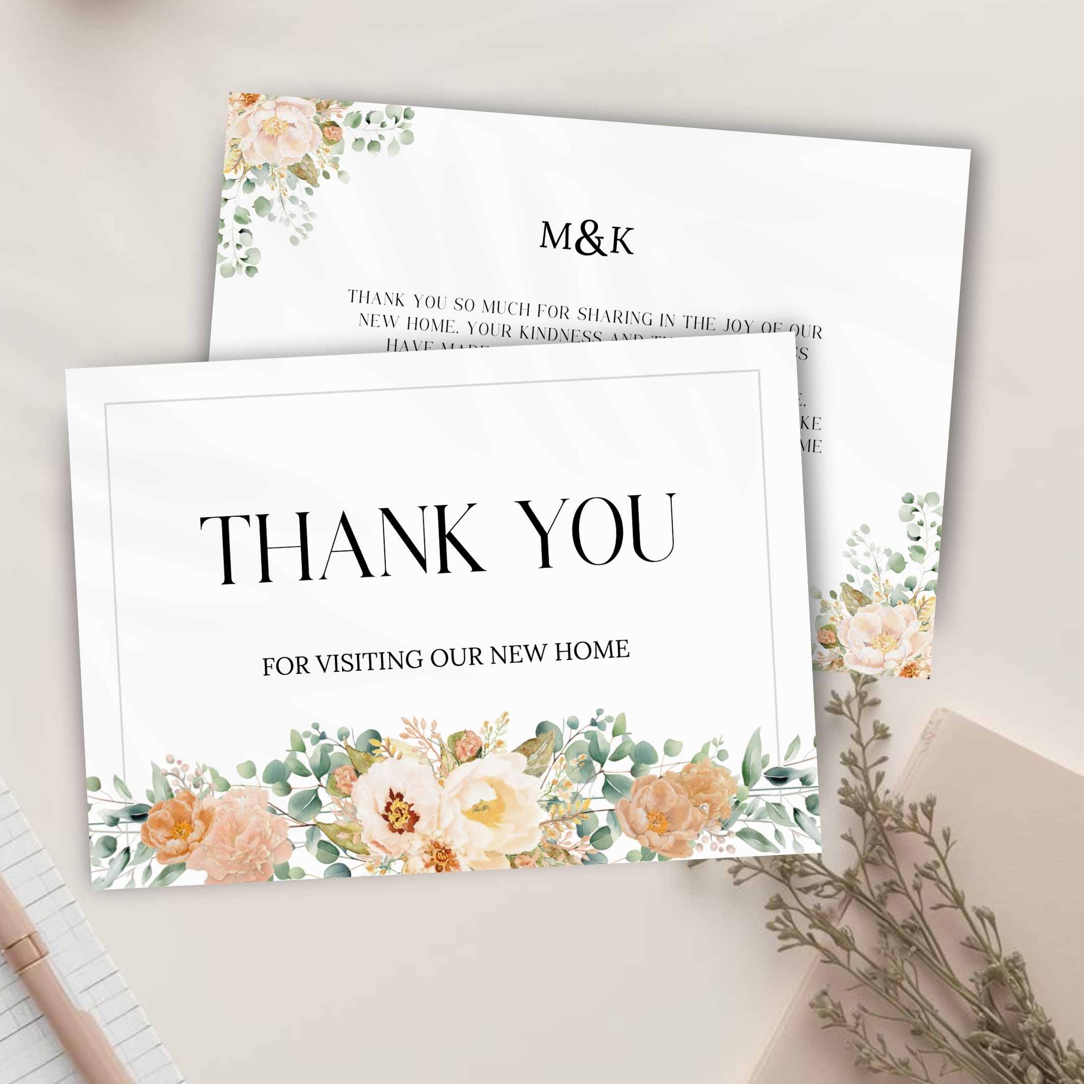 Two sides of a thank you card with botanical floral designs and 'M&K' monogram on a light background.