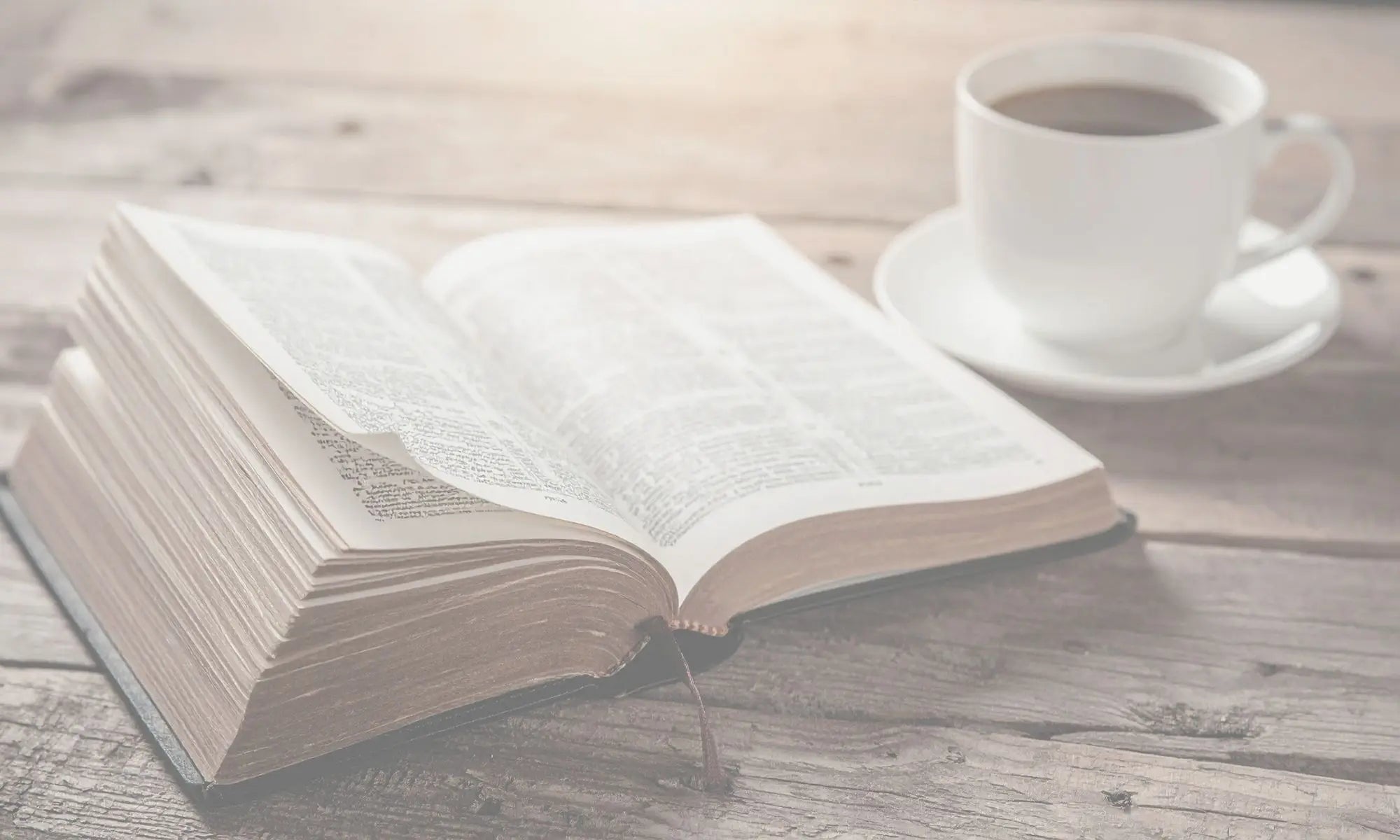 Neutral wood surface with bible and coffee mug representing editable templates for church and ministry leaders with faith-based themes.