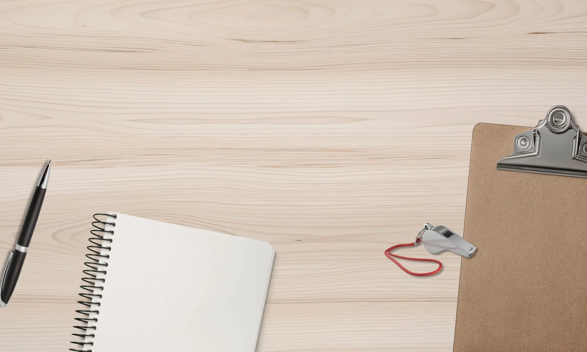 A minimalist desk with notebook, whistle, clipboard and pen representing editable templates for fundraiser, sports events, and awards and certificates designed for coaches, teams, athletic directors, and athletic booster clubs.