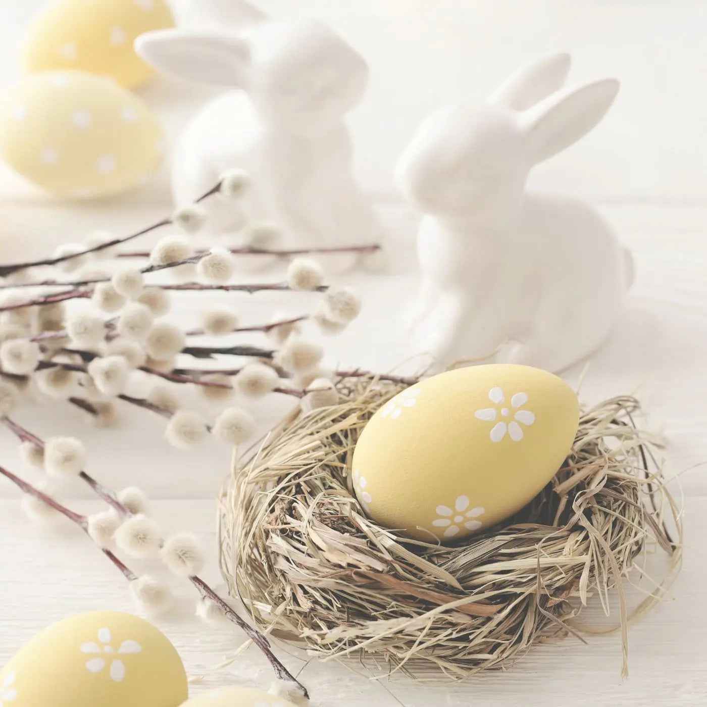 Easter decorations and bunnies with Easter eggs in preparation for an Easter Egg Hunt party with fundraiser flyers and invitations for Easter themed party invites.