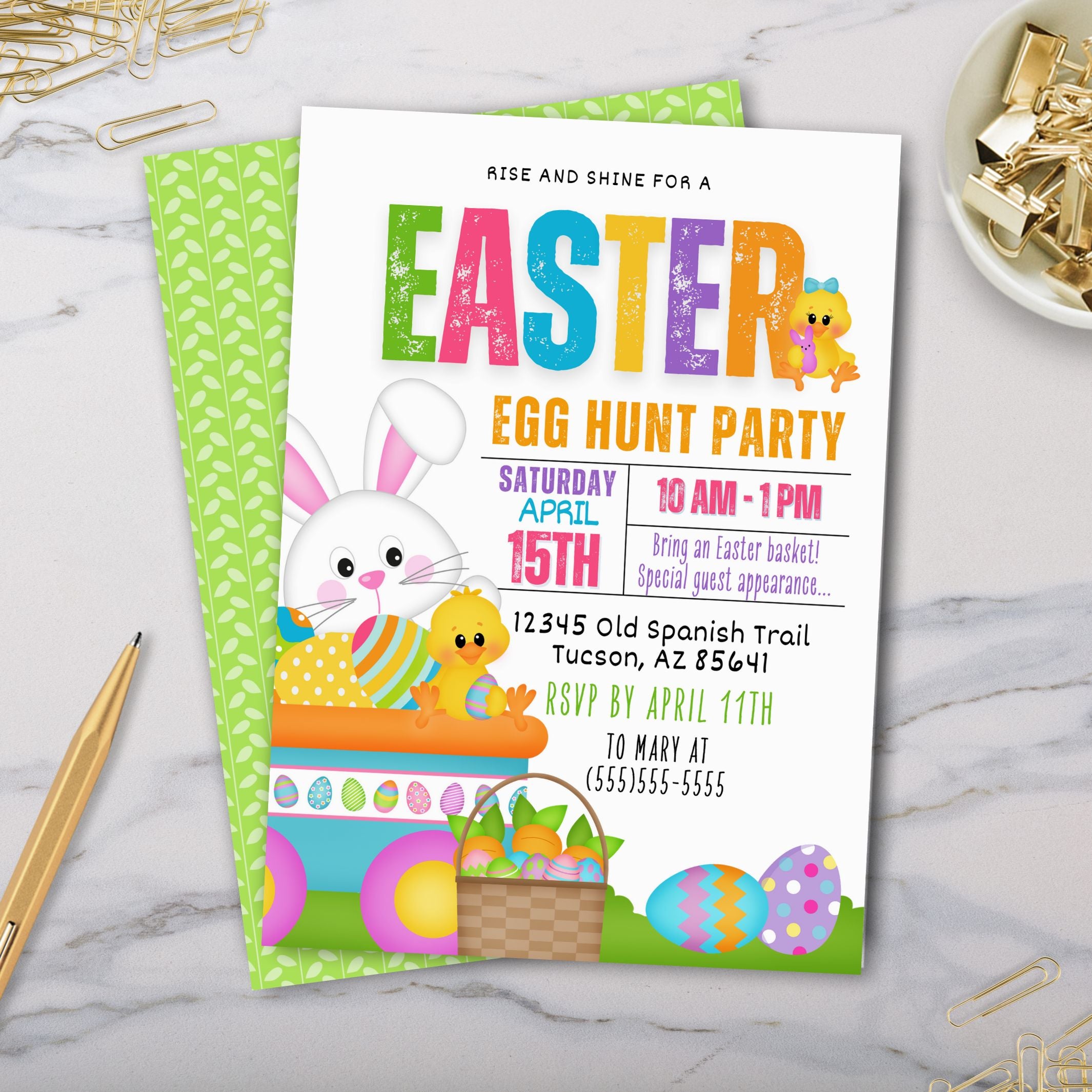 Easter egg hunt party invitation on a marble surface with stationery items.