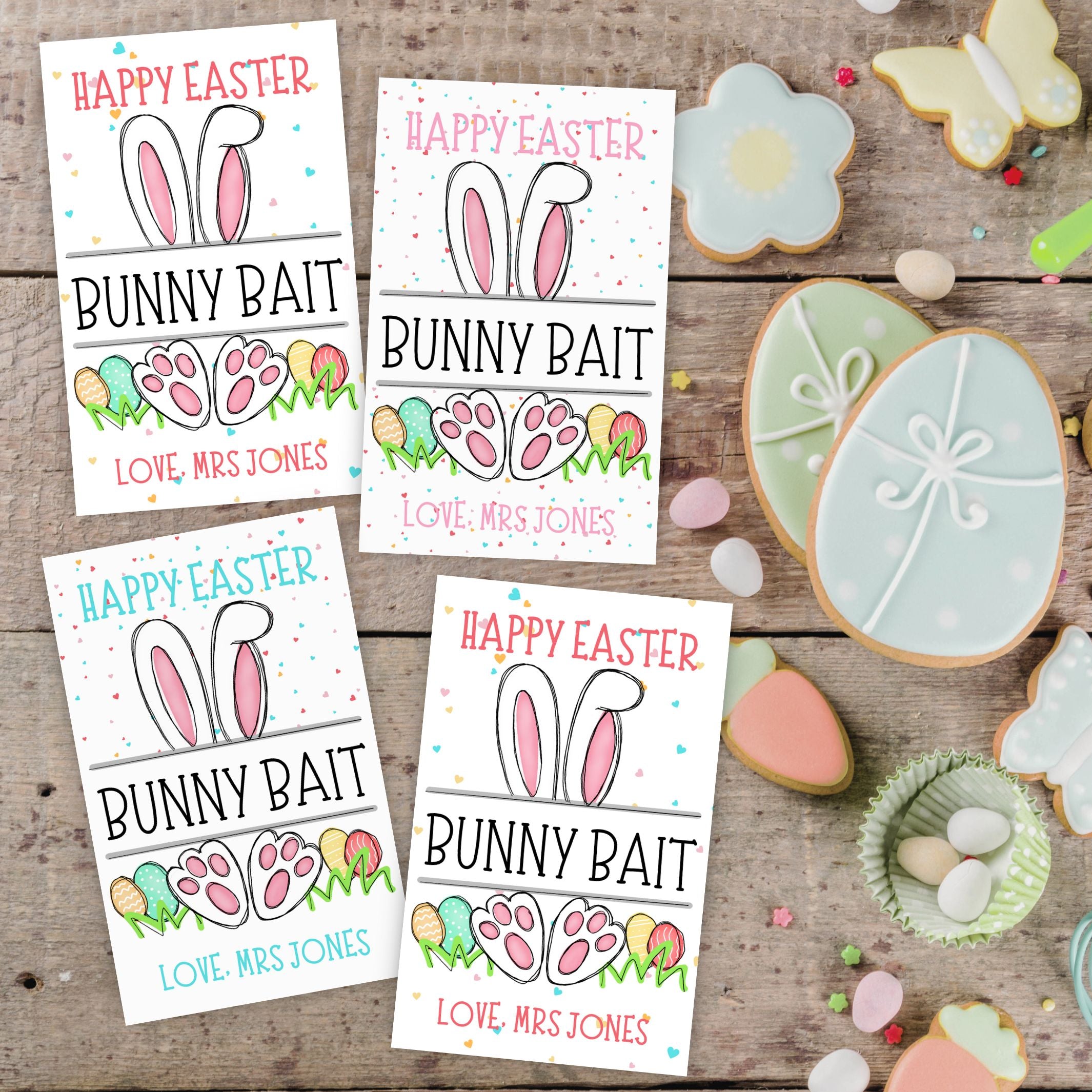 Four Easter tag cards with 'Happy Easter Bunny Bait' with 4 slight variations of pastel text and backgrounds on a wooden surface with cookies.