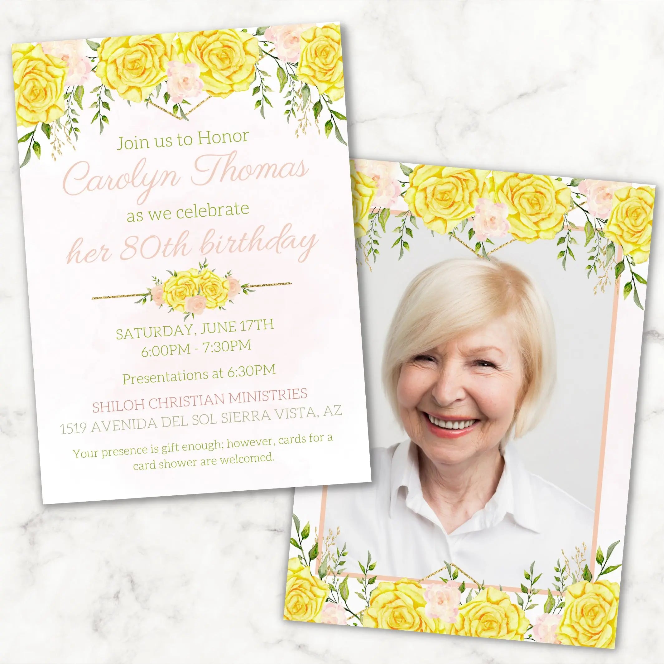 Birthday invitation card customized for 80th birthday party with yellow rose and greenery floral design and photo of a woman on a marble surface