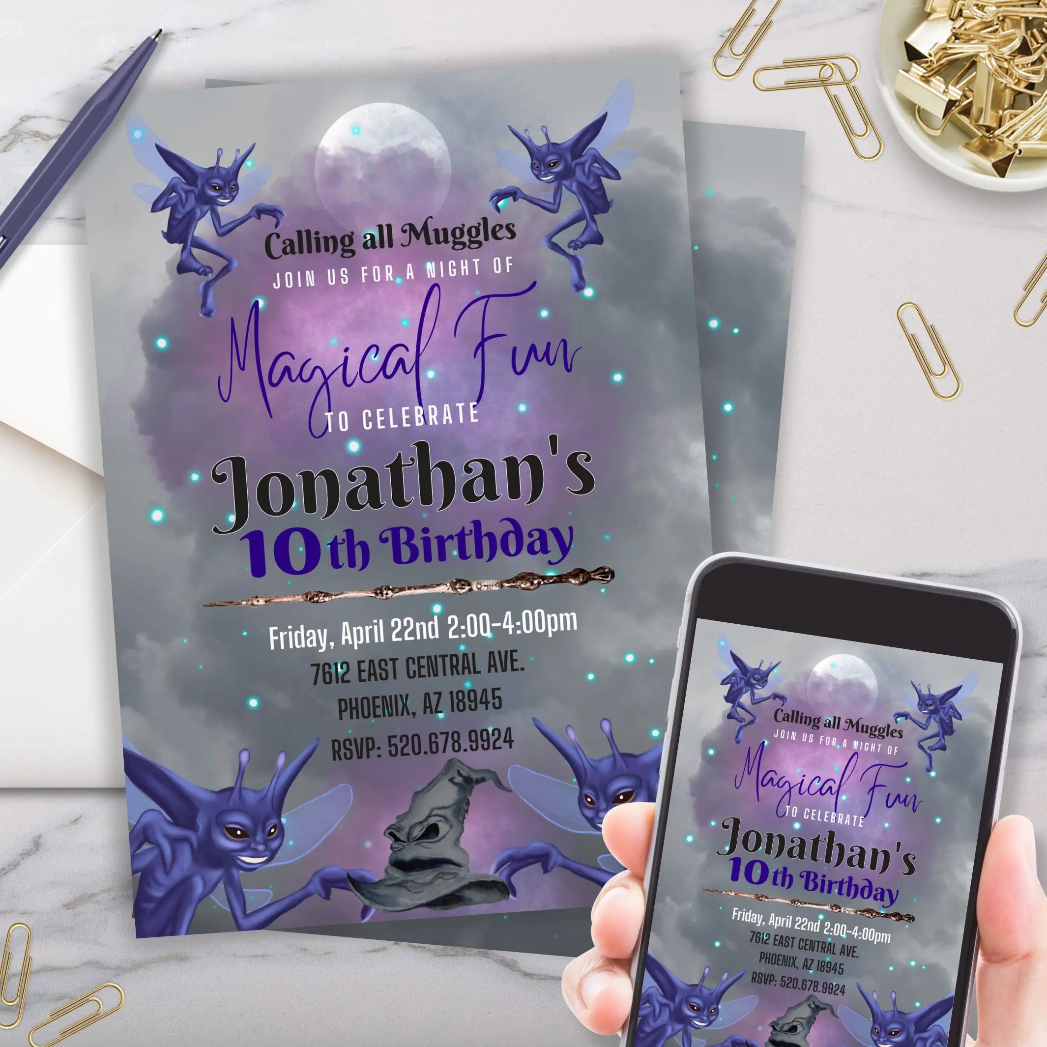 Customized fantasy birthday invitation card with purple text and characters and on a phone on marble background with gold and purple desk accessories.
