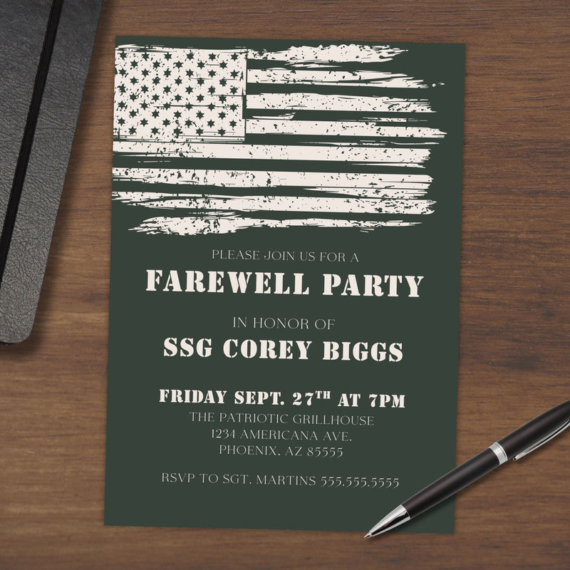 Army Green farewell party invitation with weathered American flag design on a wooden surface with a pen.