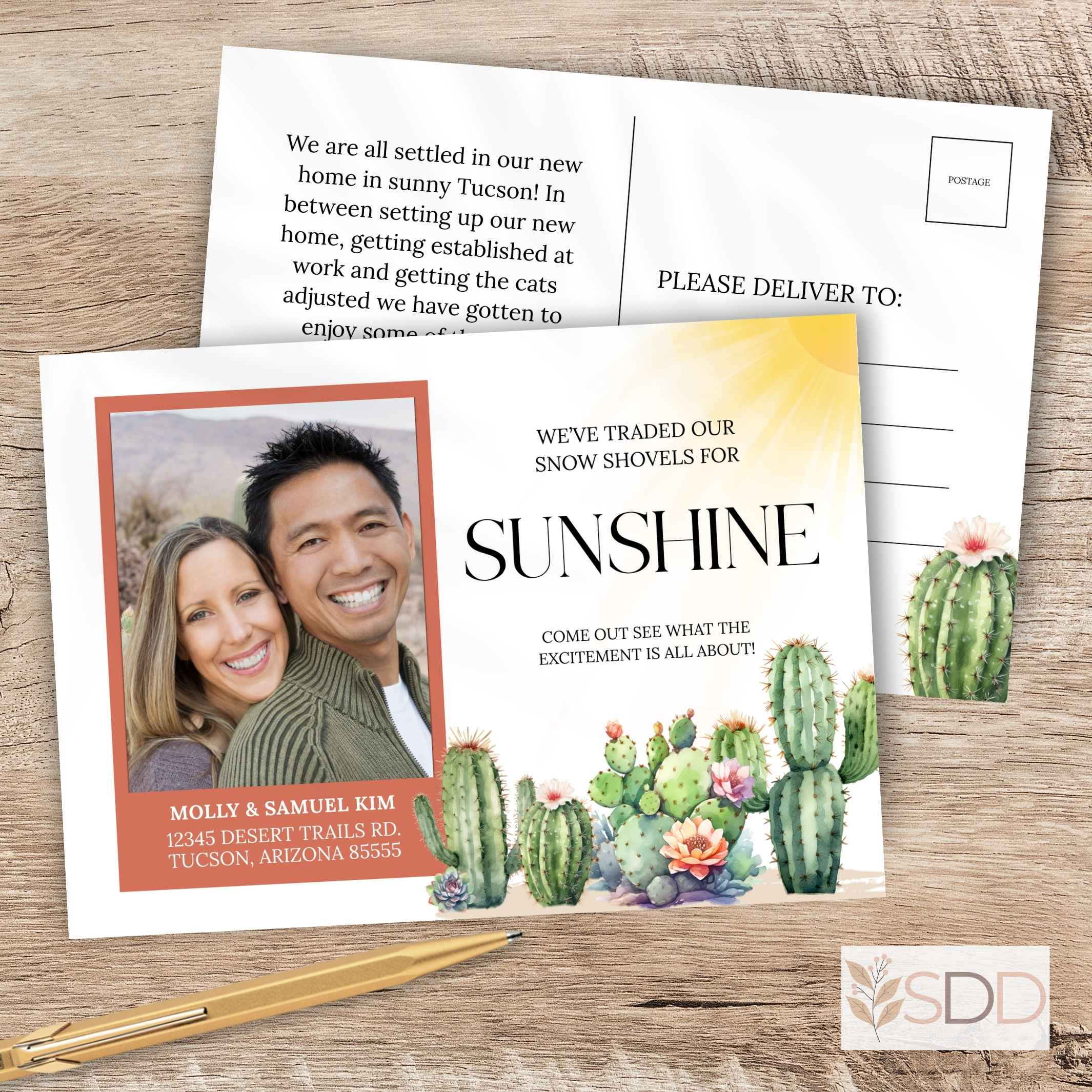 Elegant novelty botanical cactus we've moved new address card with a photo of a couple and cacti, on a wooden surface with a pen.