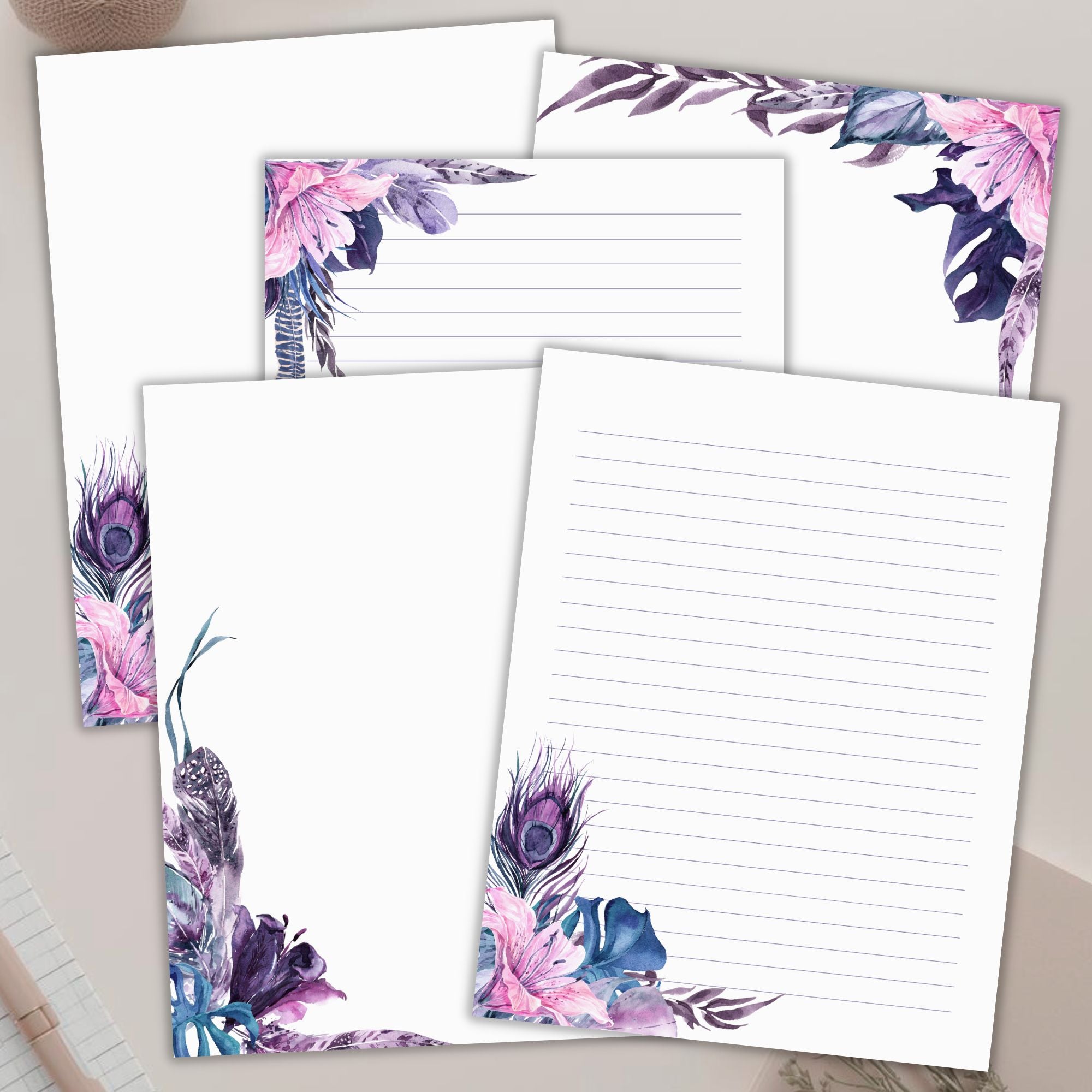 Set of stationery sheets with floral and peacock feather design on a neutral background