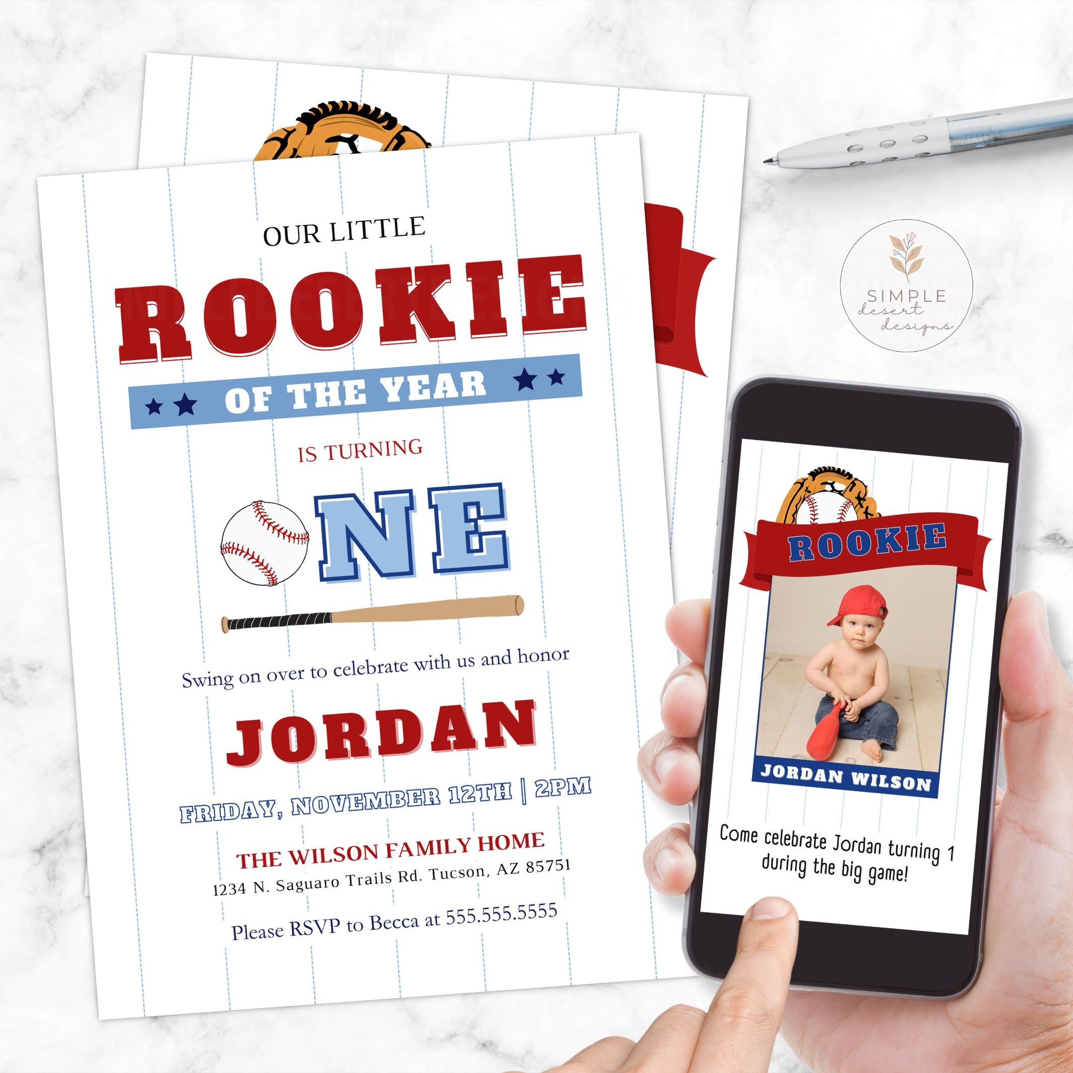 Baseball-themed birthday invitation with a smartphone displaying a photo of a child, on a marble surface.