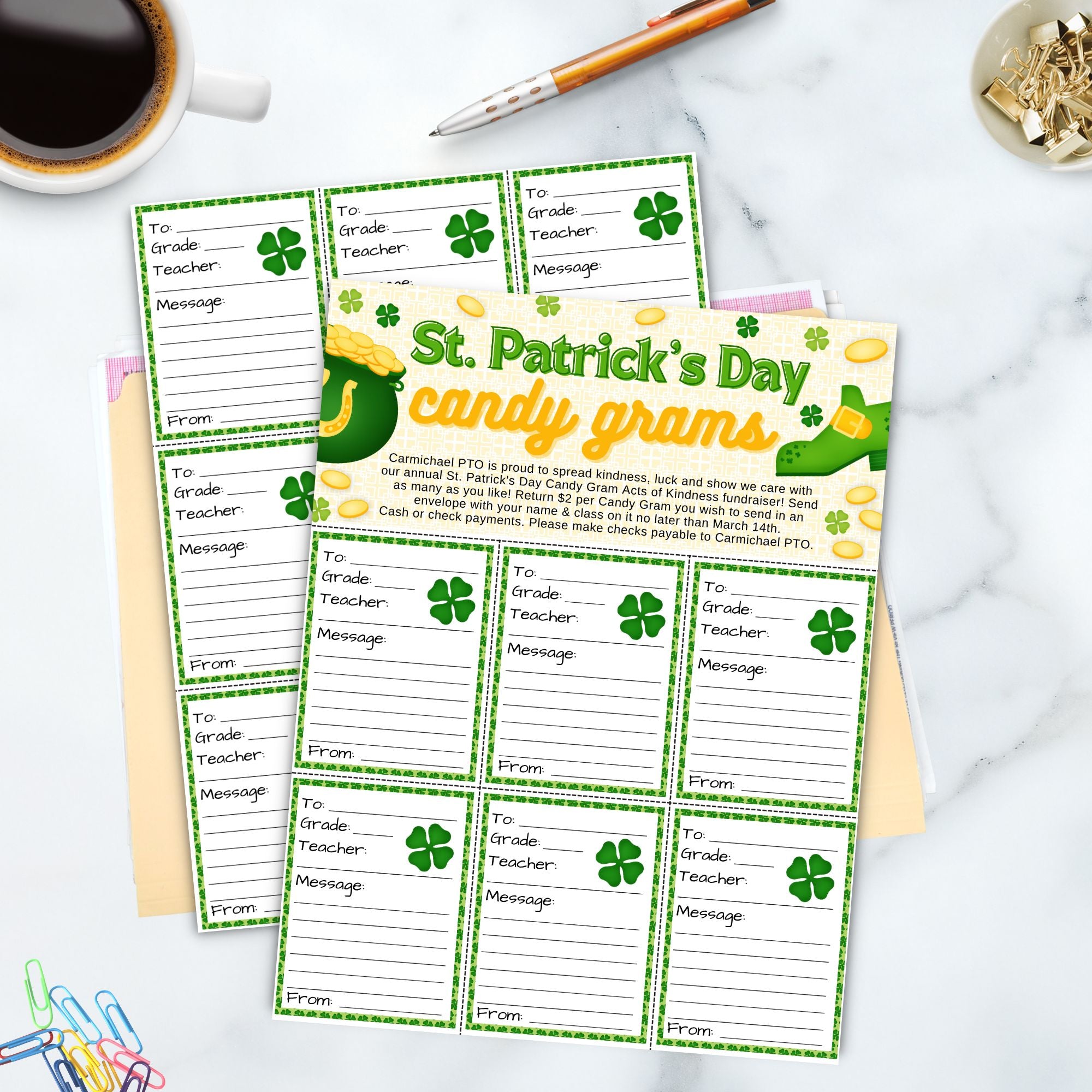 St. Patrick's Day candy gram templates on a marble surface with stationery items.