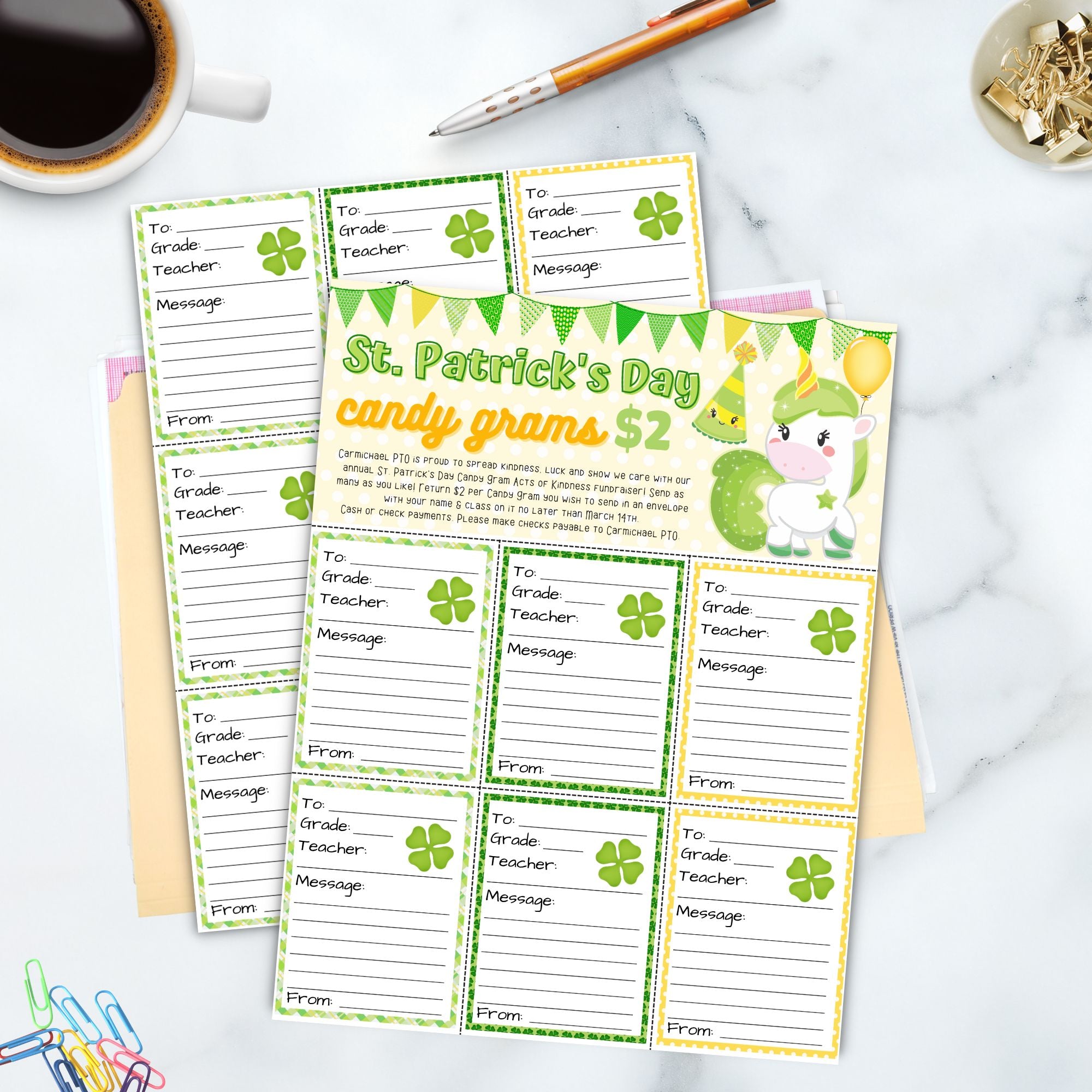 St. Patrick's Day candy gram templates on a marble surface with stationery items.