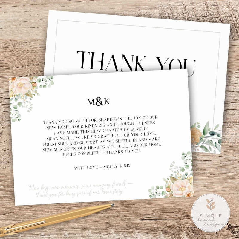 Two sided floral botanical thank you cards with floral designs on a wooden surface, accompanied by a pen.
